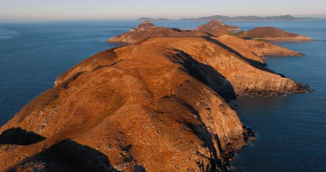 Serene Coastal Landscape with Hills and Sea