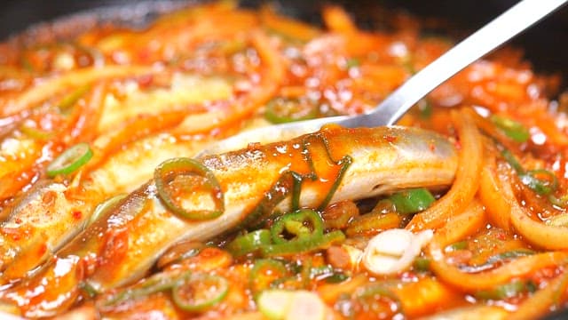 Spoonful of spicy braised onion and scallions