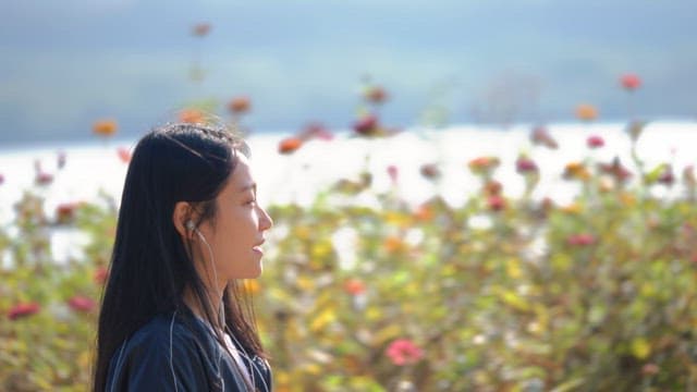 Woman listening to music outdoors