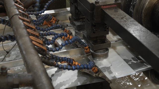 Liquid material flowing through machinery
