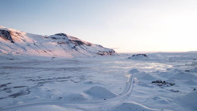 Snow-covered mountains and vast plains