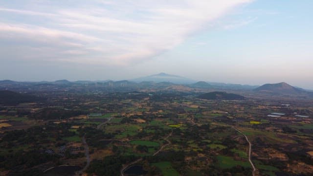 Expansive landscape with distant mountains