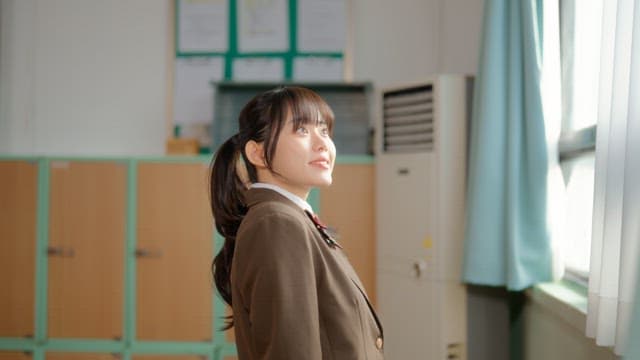 Student looking out the classroom window