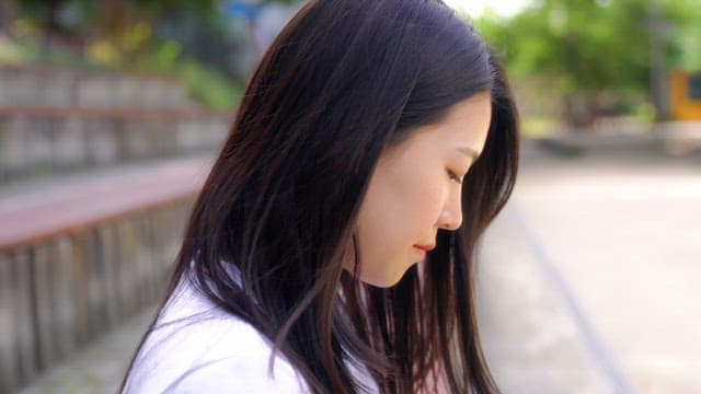 Woman sitting on the stairs and smiling