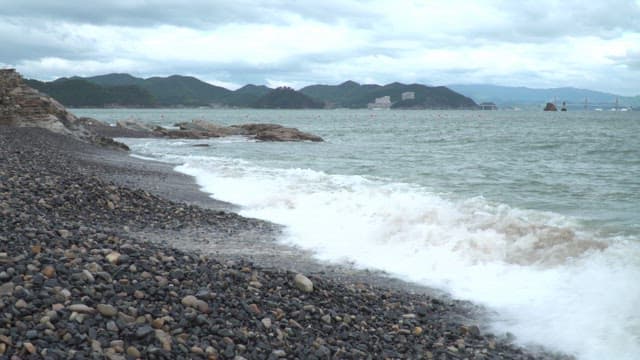 Waves crashing on a rocky shore