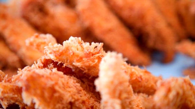 Freshly fried crispy fish fillets in the basket