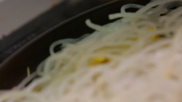 Glass noodles and pork prepared in a pot