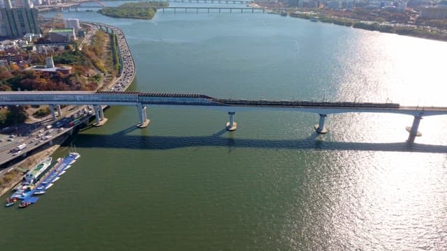 Bridge over a river with city skyline