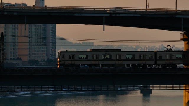 Train crossing a bridge in the city