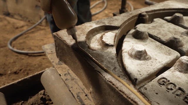 Scene of applying glue to mold in workshop