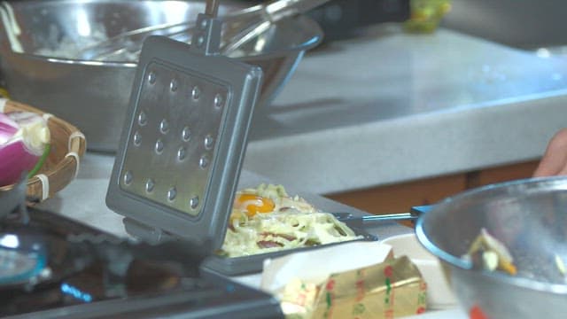 Cooking a vegetable-filled waffle with an iron
