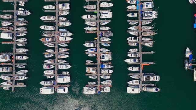 Yachts orderly moored at a peaceful marina