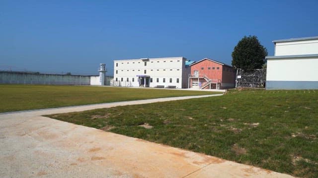 Peaceful Prison Yard under clear skies
