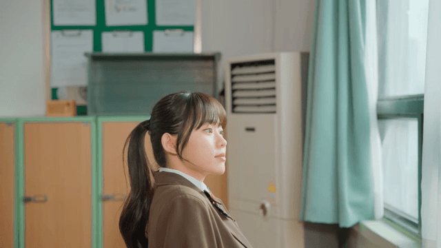 Student gazing out the classroom window