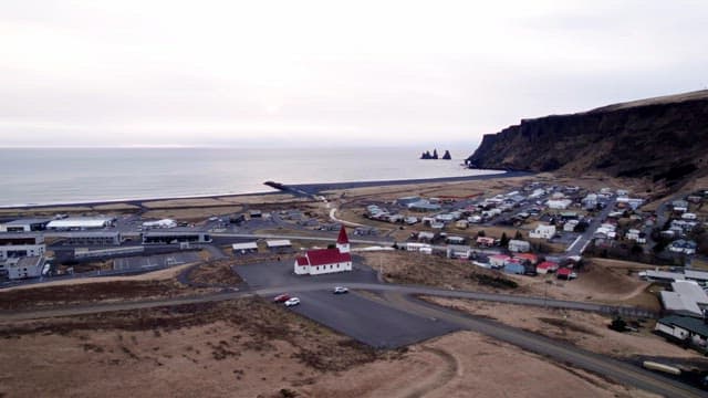 Coastal village with a red-roofed church