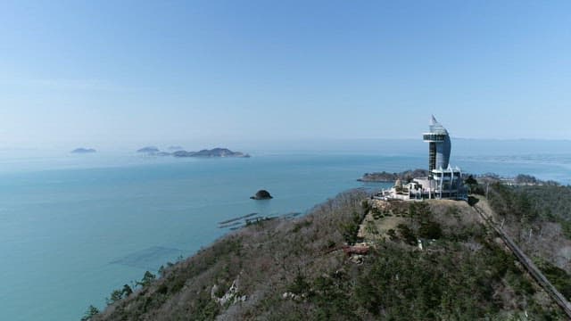 Ocean view from a hill with a observation tower