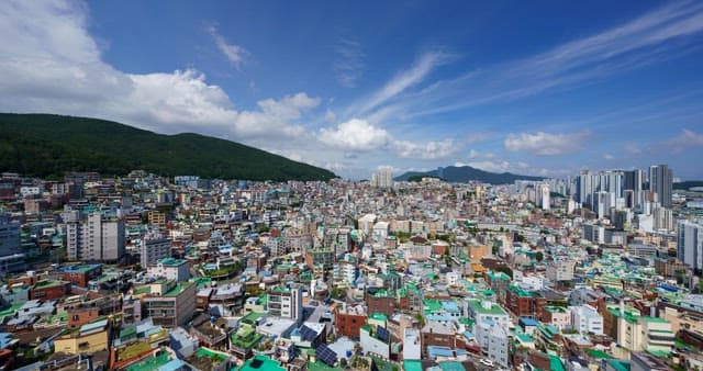 Urban view with densely packed buildings under a cloudy sky