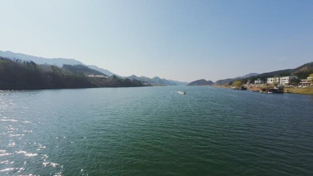 Boat cruising on a scenic river