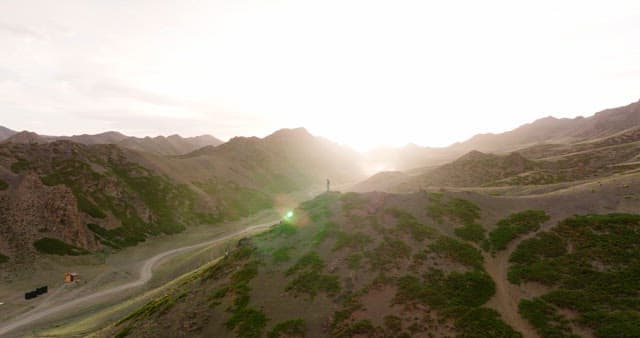 Person standing on a mountain ridge