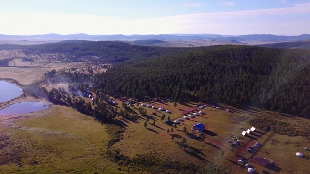 Scenic view of a forest and yurts