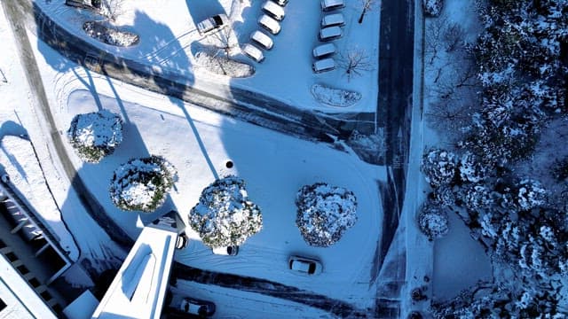 Snow-Covered Urban Park and Streets from Above