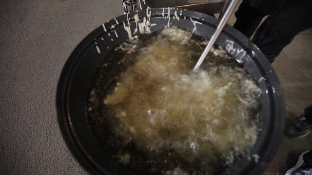 Oil boiling in a large pot for frying