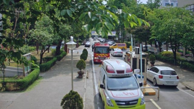 Ambulance and Fire Trucks Driving on City Roads