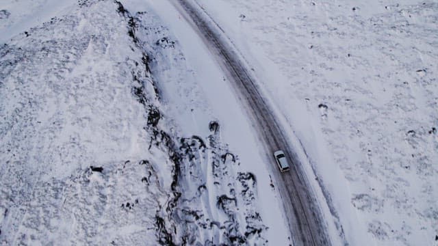 Car driving on a snowy road