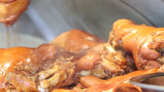 Delicious pig's feet served on a tray in the kitchen