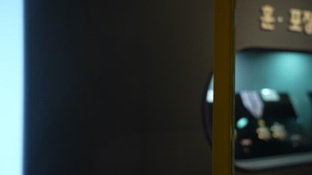Museum display showcasing various medals and decorations behind glass