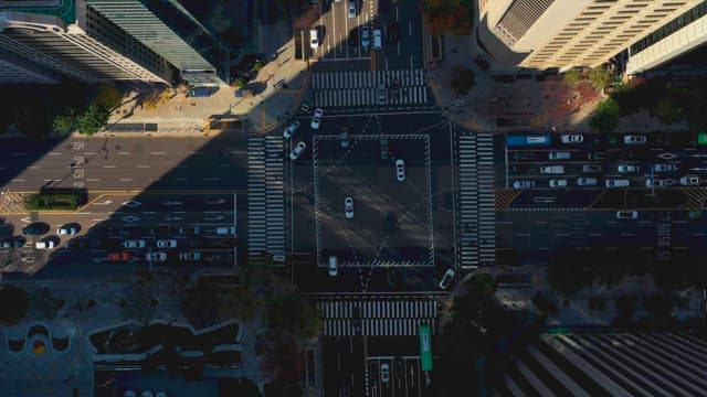 Busy city intersection with moving cars