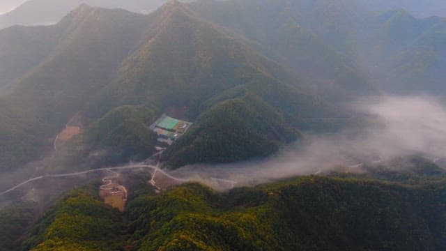 Misty Mountains with Winding Roads