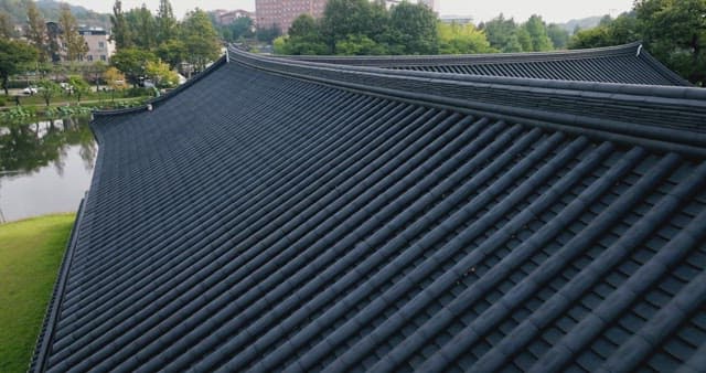 Traditional Korean roof and serene pond