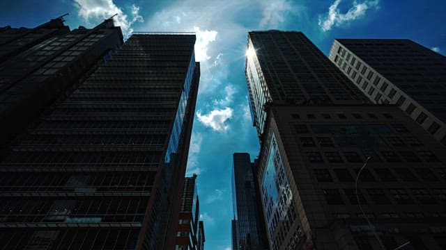 Sun Peering Between Urban Skyscrapers
