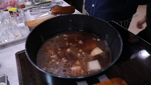 Cooking soup with radish in a pot