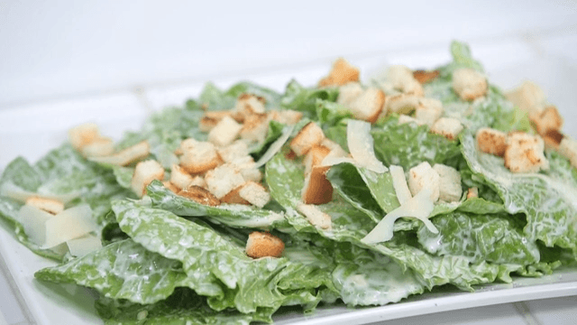 Fresh spring cabbage salad with croutons and cheese