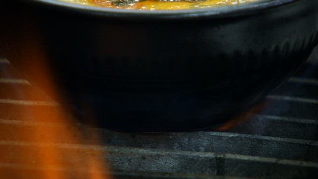 Spicy Korean beef and rice soup boiling in a pot