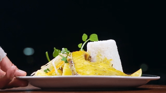 Tuna steak with vegetable garnish and rice