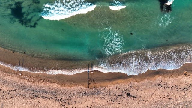 Waves crashing on a sandy beach