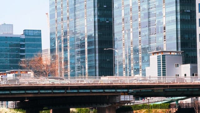 City Bridge with Pedestrians and Modern Buildings