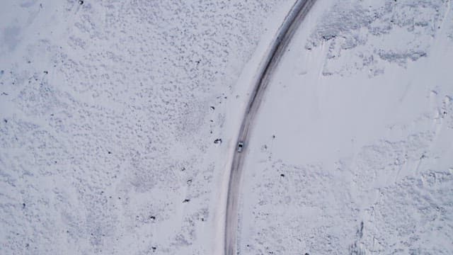 Car driving on a snowy road