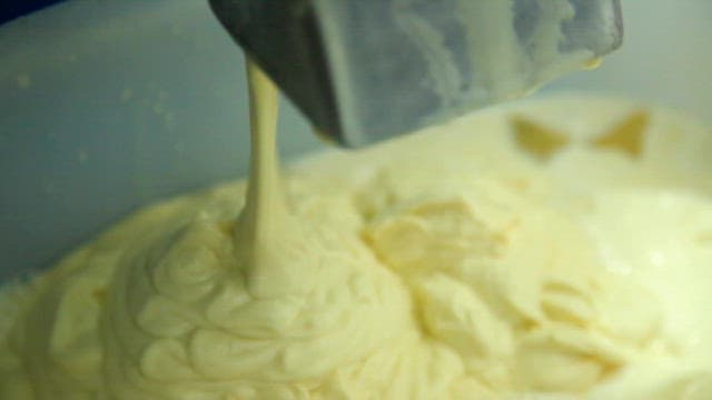 Soybean dough being poured into a container