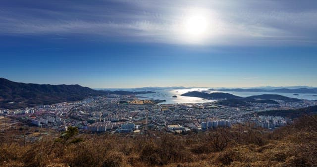 Day to night views of the city along the coastline