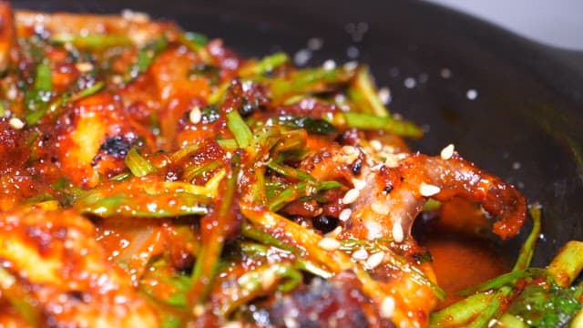 Spicy Stir-fried Webfoot Octopus with Green Onions and Sesame Seeds