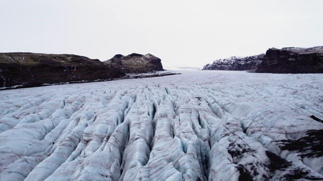 Vast glacier stretching between mountains