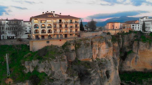 Nuevo bridge and cliffside buildings