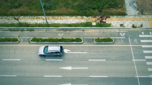 Car driving on a quiet road in the city