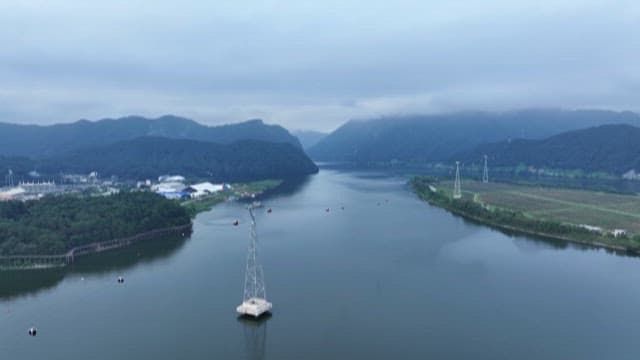Serene Lake Landscape with Cloudy Mountains