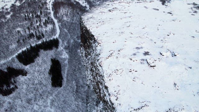 Snow-covered landscape with cliffs