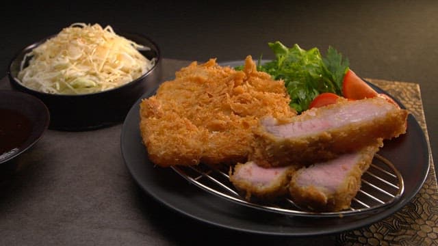 Crispy pork cutlet with fresh salad